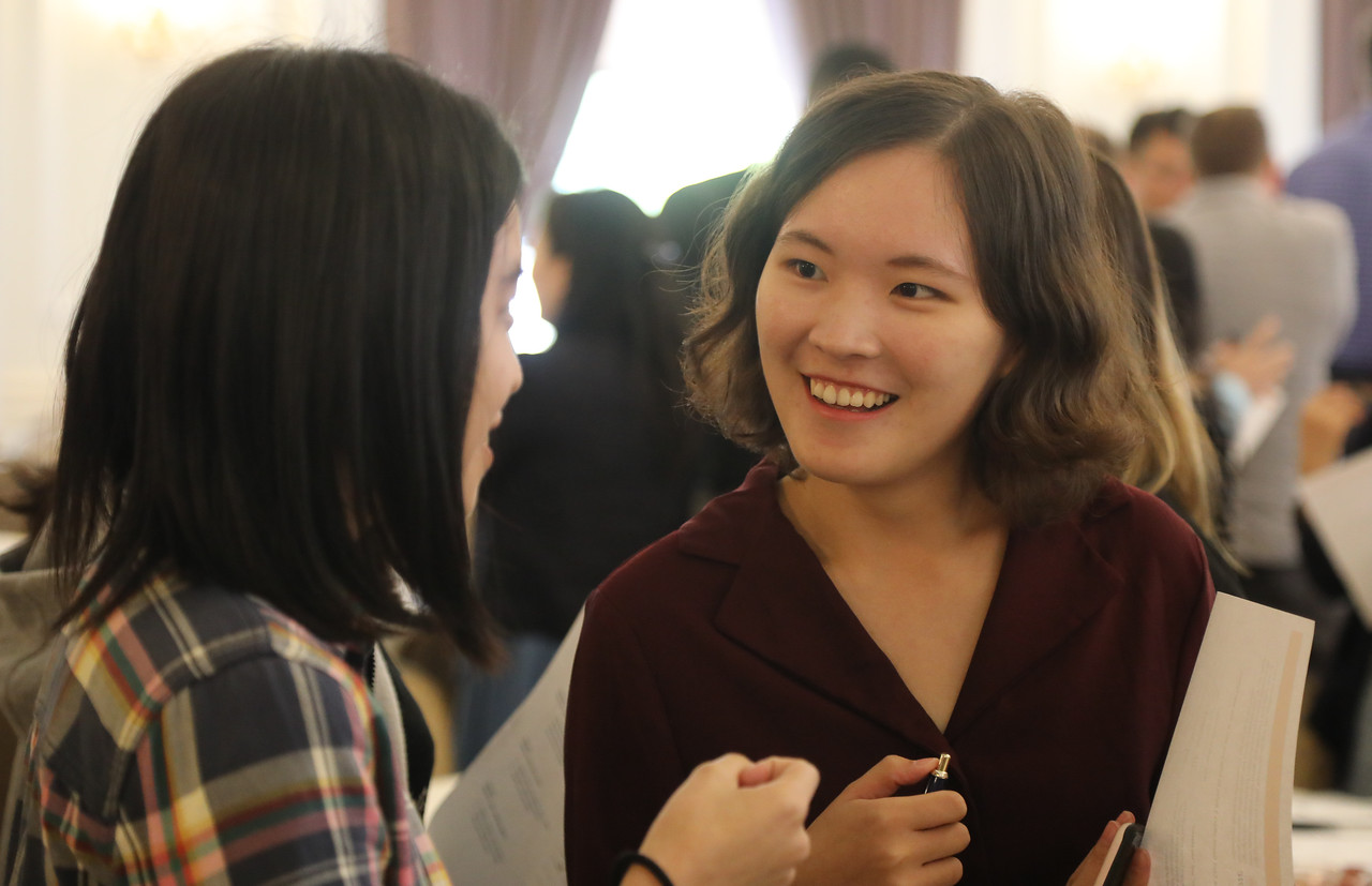 Two students having a conversation at a Pitt Business event Two students having a conversation at a Pitt Business event