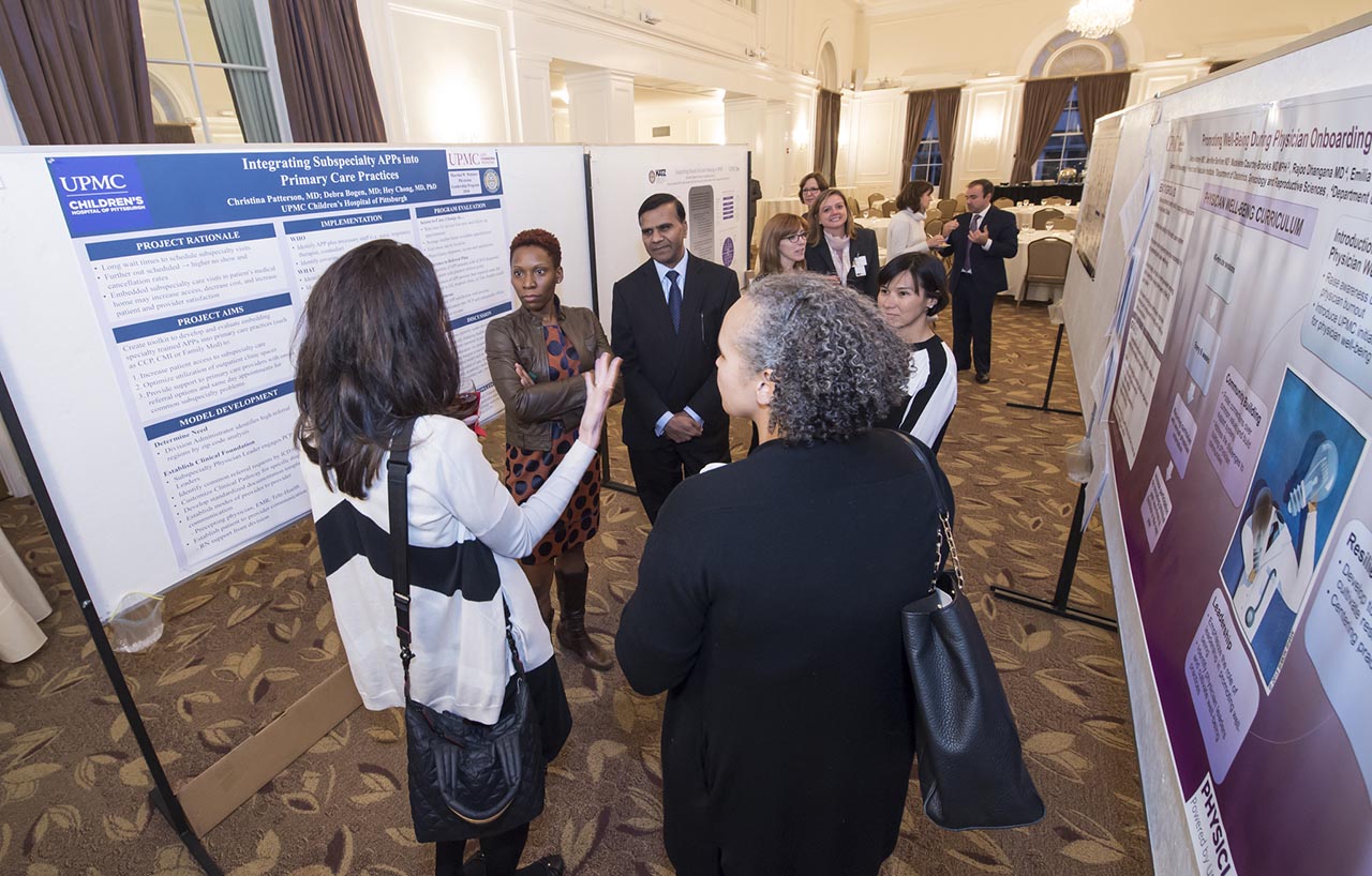 A group of people discussing research