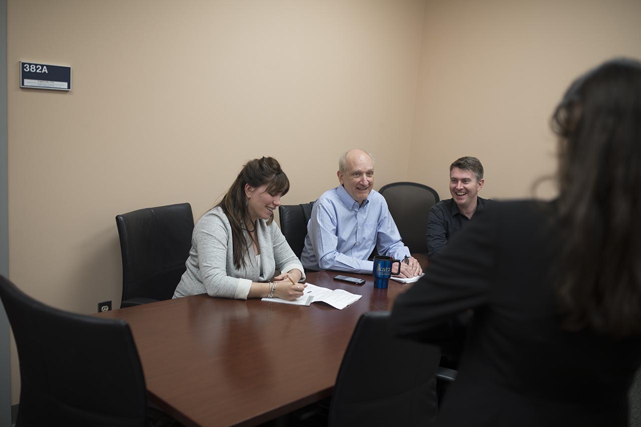 Students talking with a faculty member