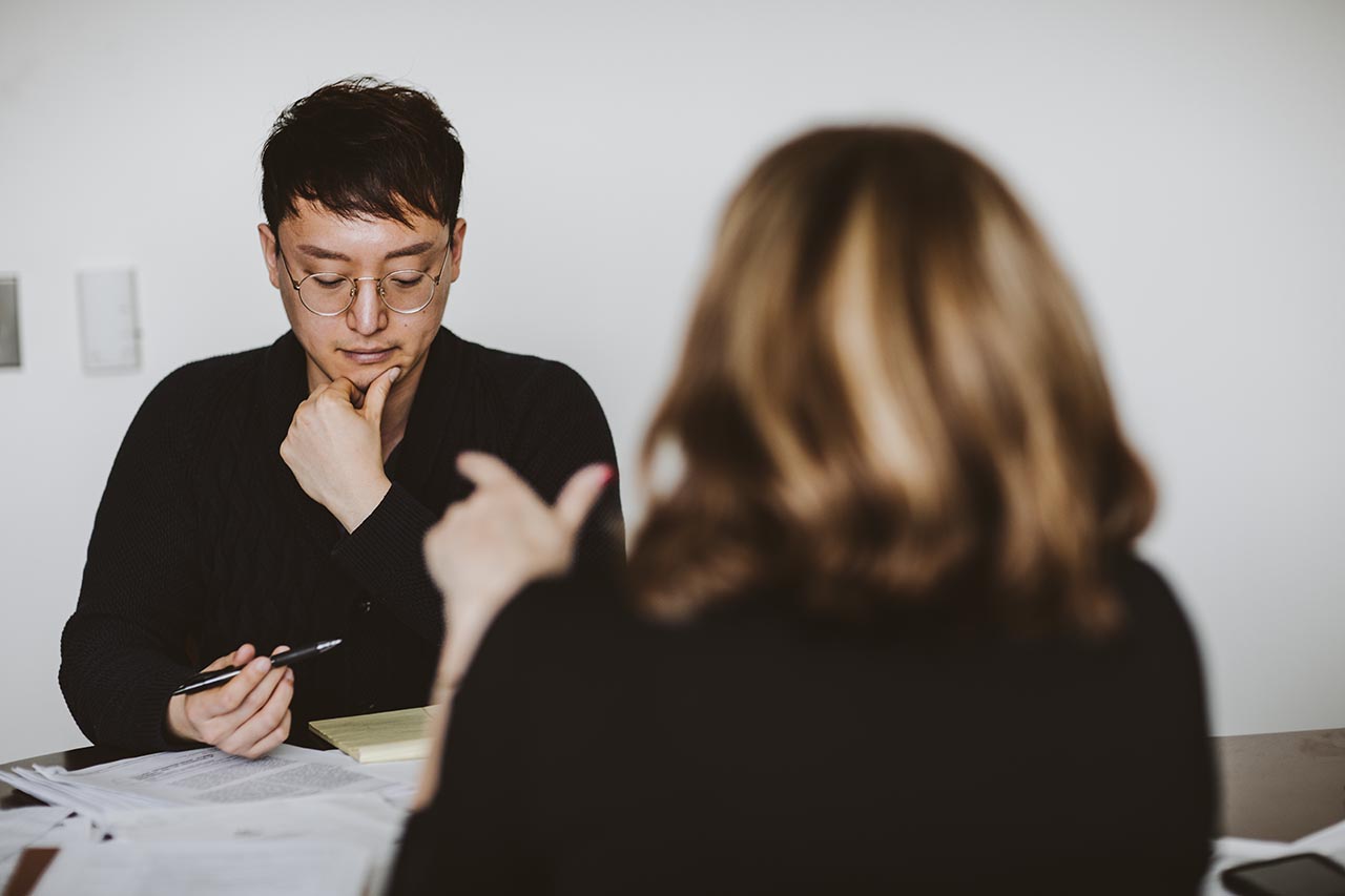 Two students discussing a research project in a Mervis Hall team room