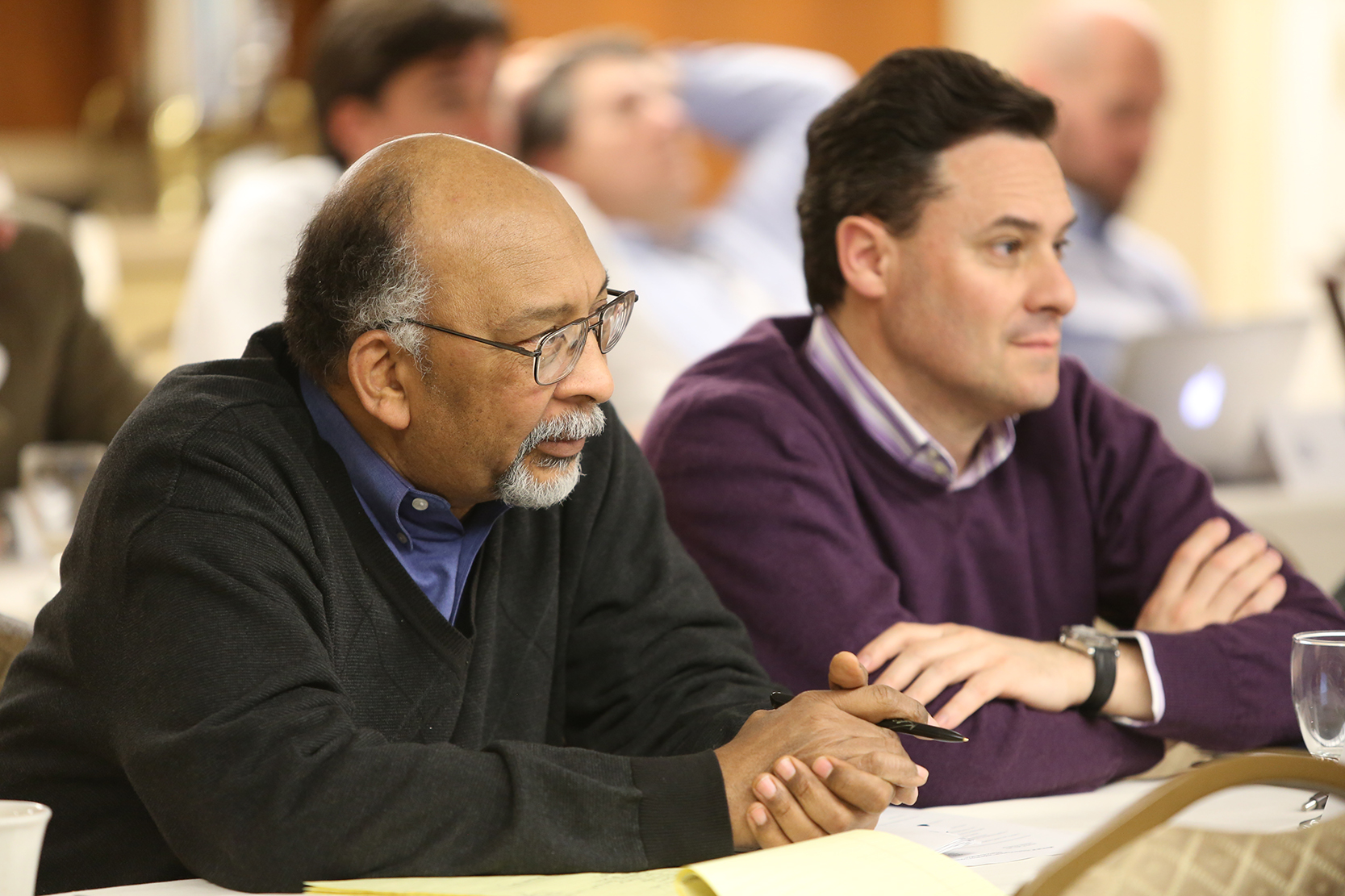 A Professor lecturing about a finance topic in the Finance Lab